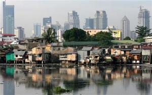 Background: Makati skyline; foreground: slums by the Pasig River